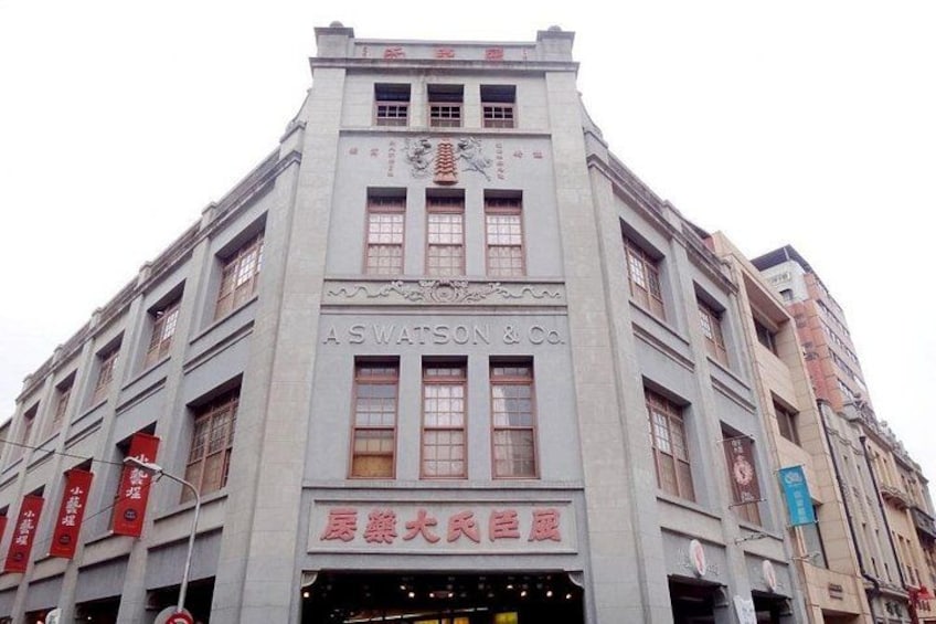A building with the sign 'ASWATSON & Co.' and Chinese characters. 1