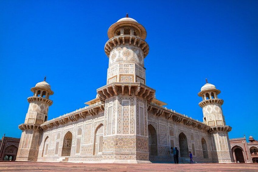 A large, ornate building with multiple domes and minarets, featuring intricate architectural details. 2