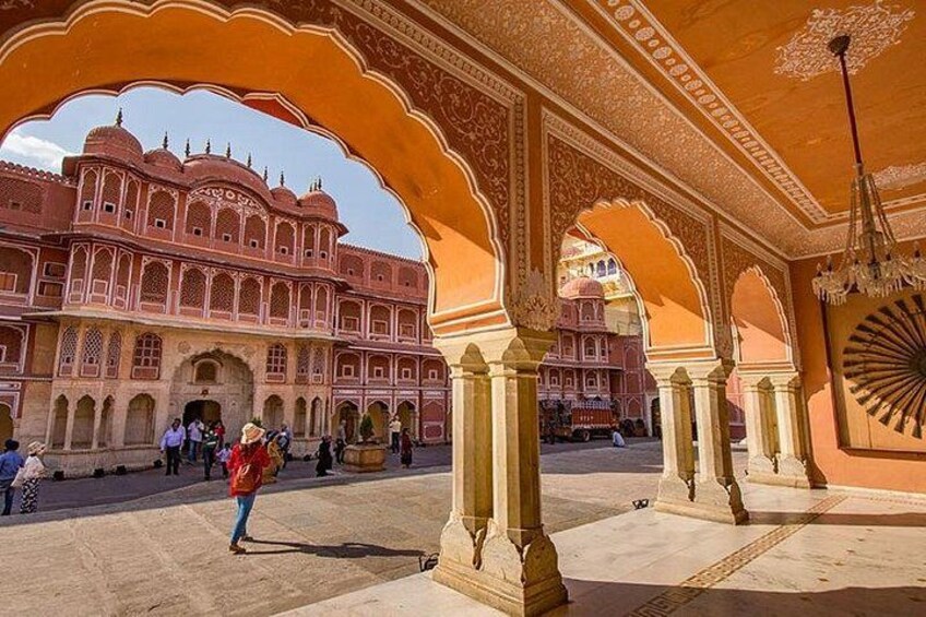 A historic building with intricate arches and a courtyard. 3