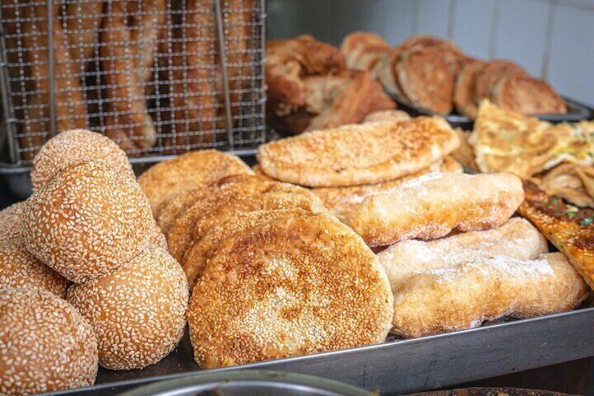 Walk up to this cheerful hole-in-the-wall and grab a selection of their sweet and savory dough sticks and flatbreads, just like the locals do.