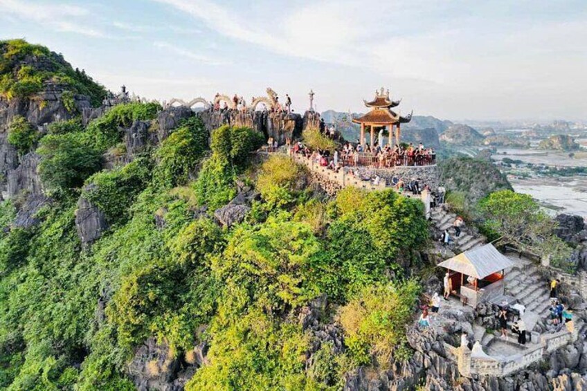 A rocky landscape with a pagoda and a viewing platform. 5