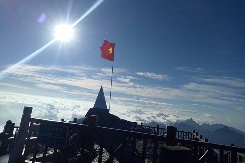 Vietnam flag with sunrise on Fansipan peak 2