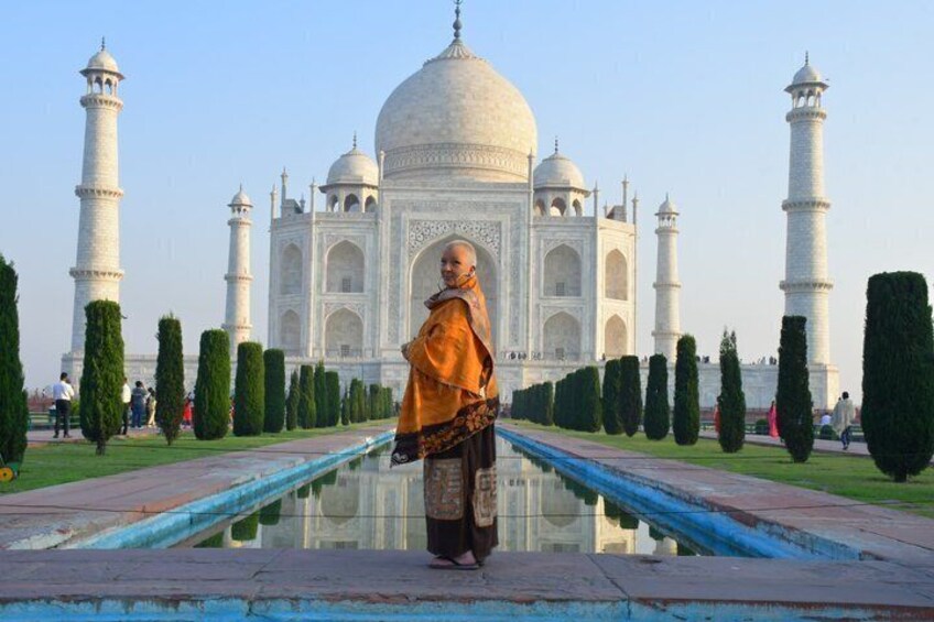 The Taj Mahal with a person standing in the foreground. 5