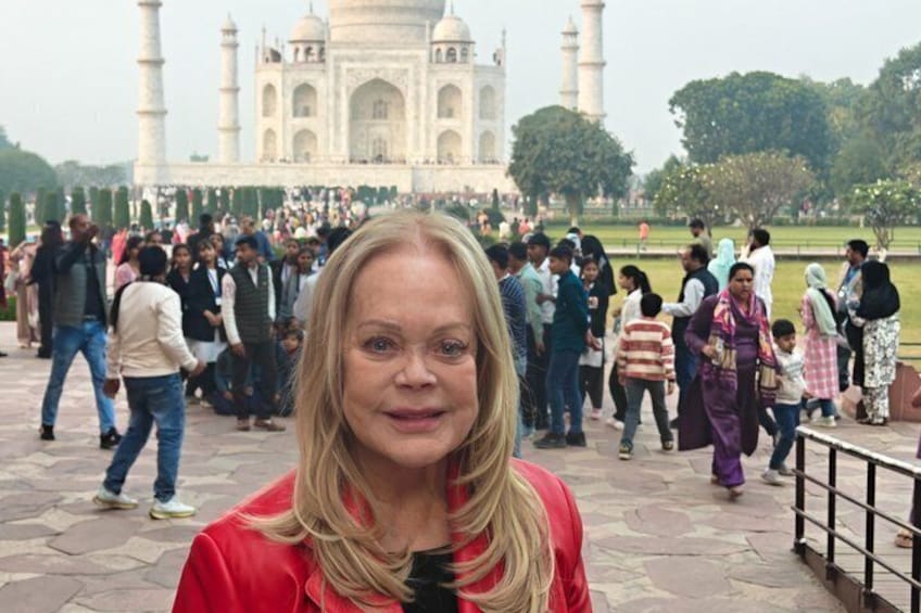 A crowd of people in front of the Taj Mahal. 3