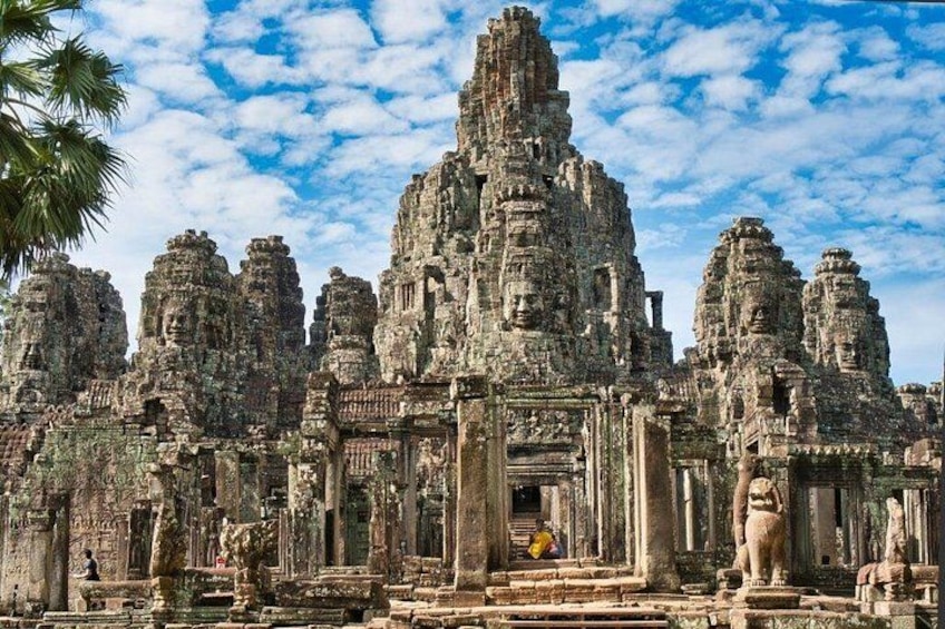 A large, ancient temple complex with multiple towering structures and intricate carvings. 3