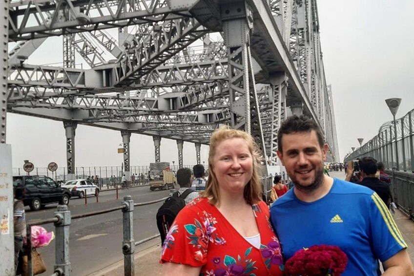 A bridge with metal trusses and a pedestrian walkway. 4