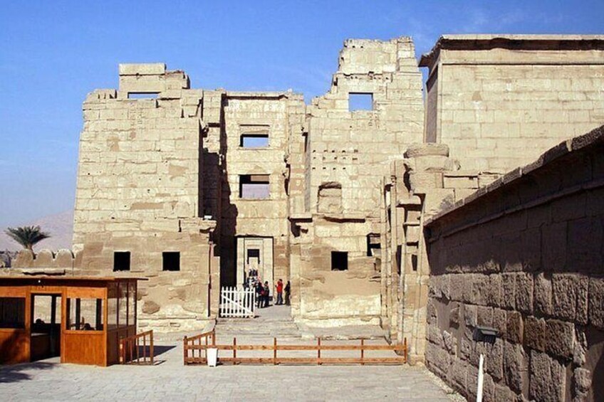 An ancient stone structure with a central staircase leading to an entrance. 5