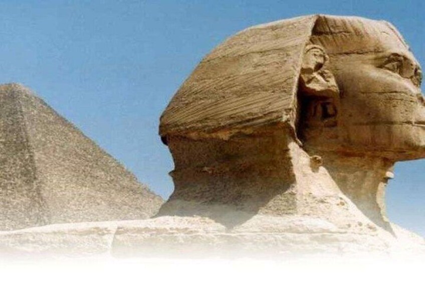 The Great Sphinx of Giza with a pyramid in the background. 1