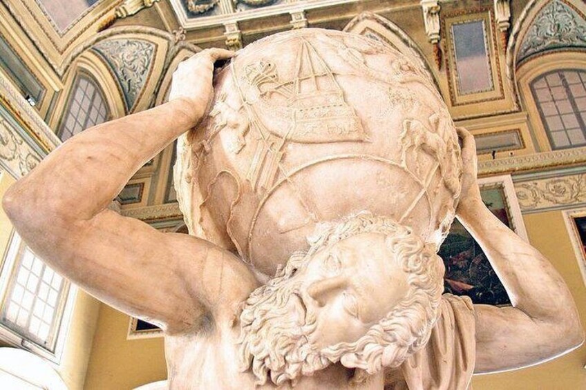 A marble sculpture of a reclining figure with a ship and waves on its chest, set against a detailed architectural background. 1