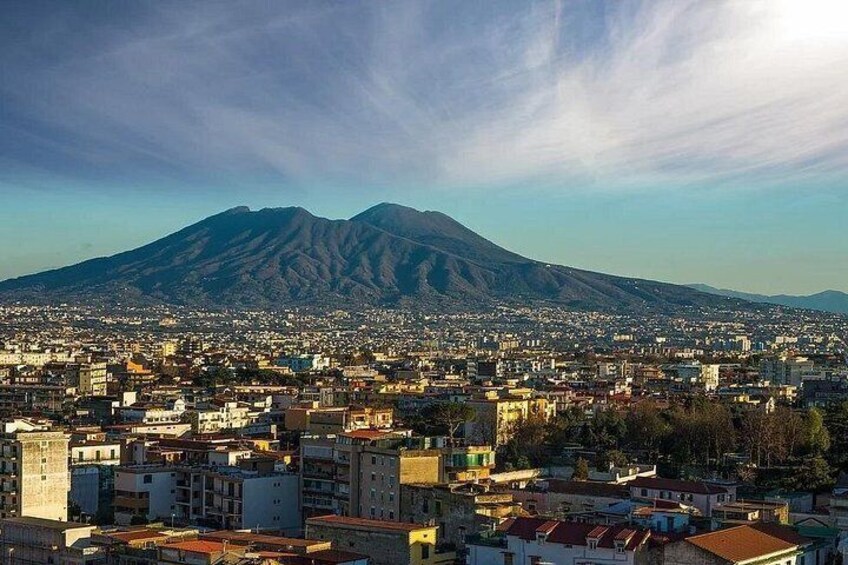 A cityscape with a prominent mountain in the background. 2