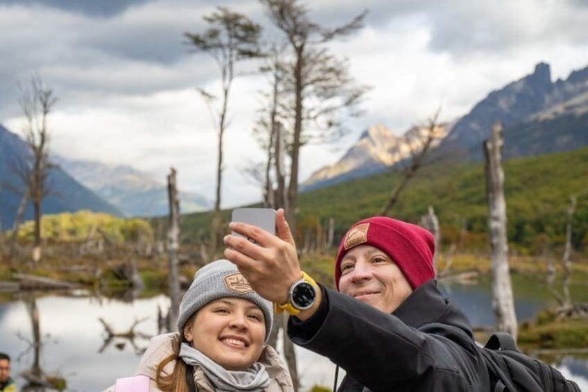 Two people taking a selfie with a mountainous landscape in the background. 5
