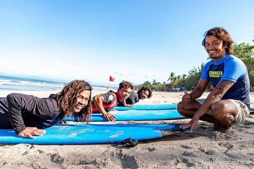 People on a beach with surfboards. 1