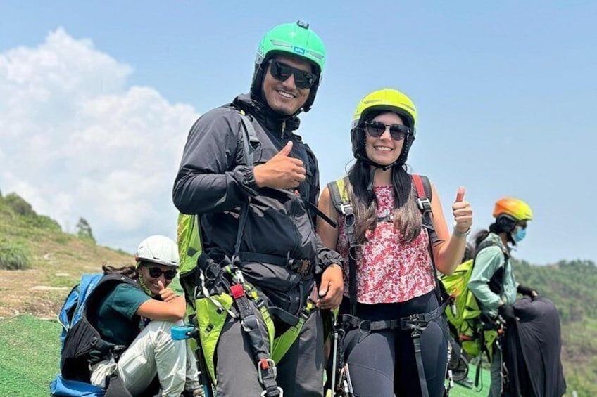 A group of people wearing helmets and backpacks, likely engaged in an outdoor activity such as hiking or mountain biking. 4
