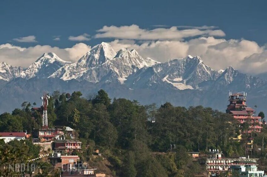 A mountainous landscape with snow-capped peaks, a red pagoda, and a communication tower. 4