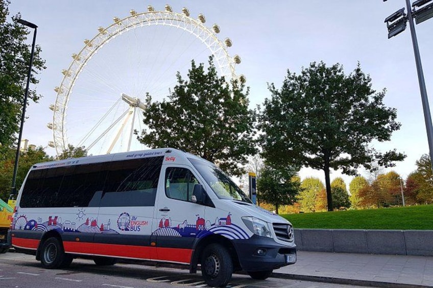 A white bus with 'English Bus' and 'City' branding parked on a street. 3
