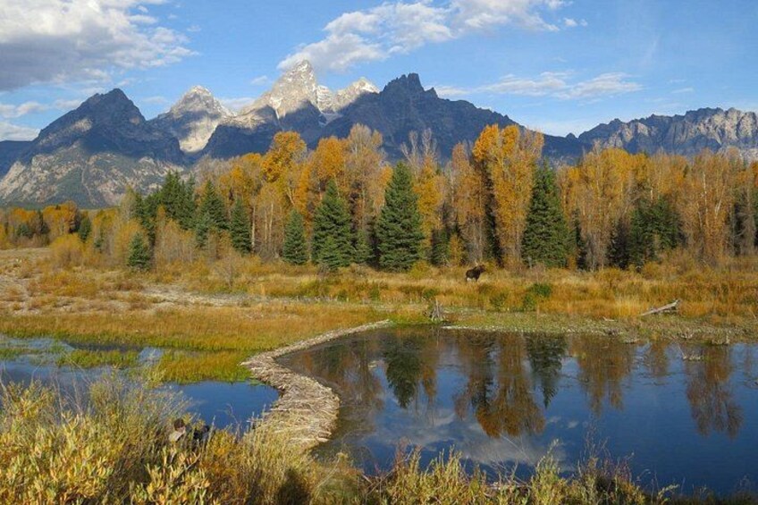 A mountain range, a river, and autumn-colored trees. 5