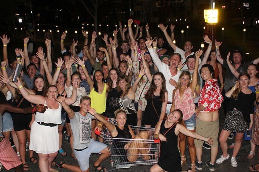 A group of people with raised hands, possibly at a concert or event. 2