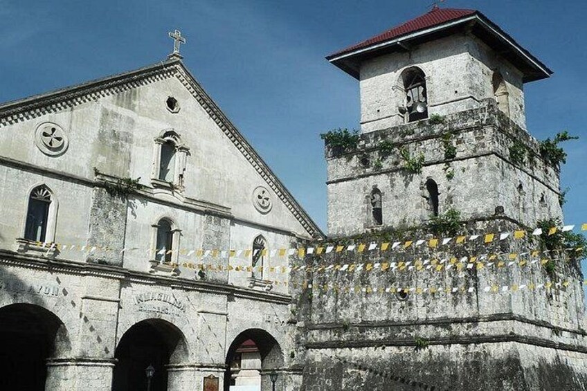 A historic building with a bell tower and arched windows. 2