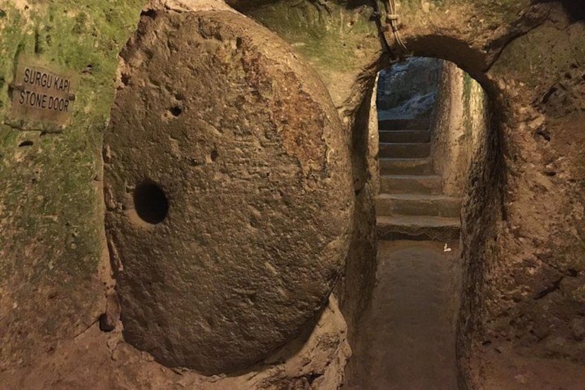A stone door labeled 'SURGU KAPI' leading to a staircase. 2