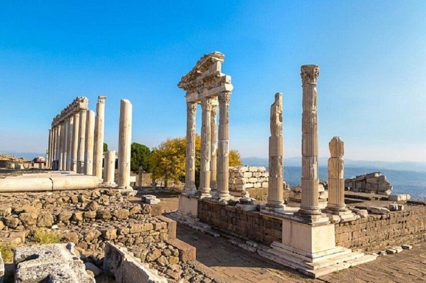 Ancient ruins with columns and stone structures. 2