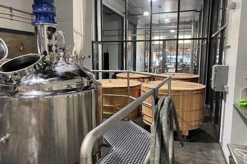 Mash tun and wooden washbacks in the brewhouse. 2