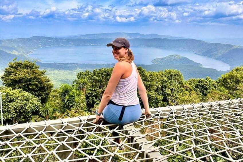 A traveler is posing in front of the santa ana volcano crater 4