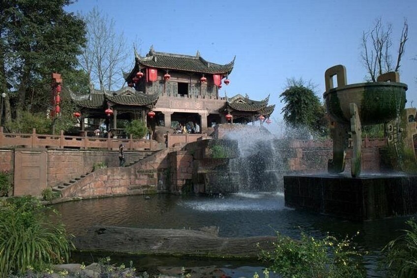 A traditional Chinese building with a water feature in front. 5