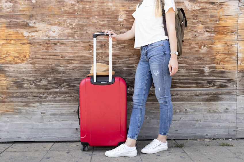 Passenger with red luggage