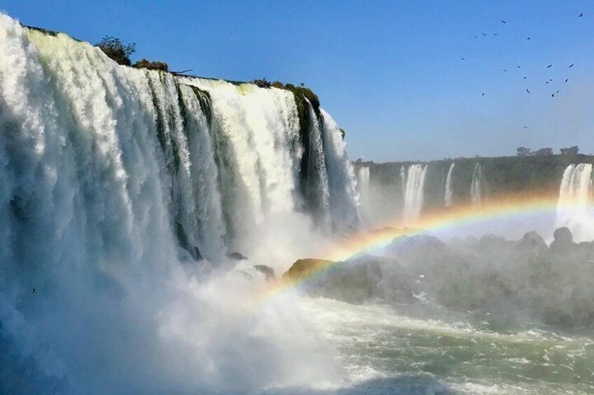 A waterfall with a rainbow. 3