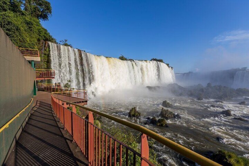 A waterfall, a viewing platform, and a railing. 5