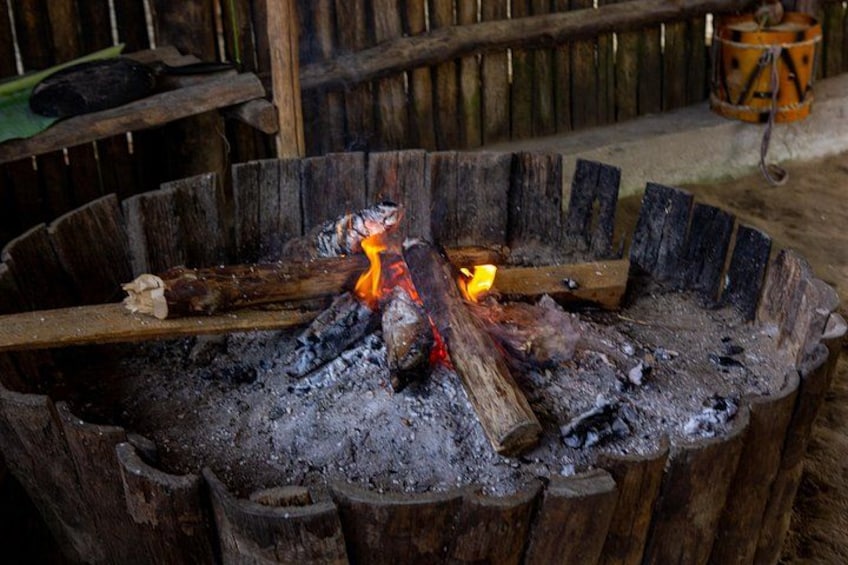 A traditional fire pit with burning wood. 4