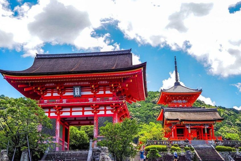 A traditional Japanese temple with a red gate and a pagoda. 3