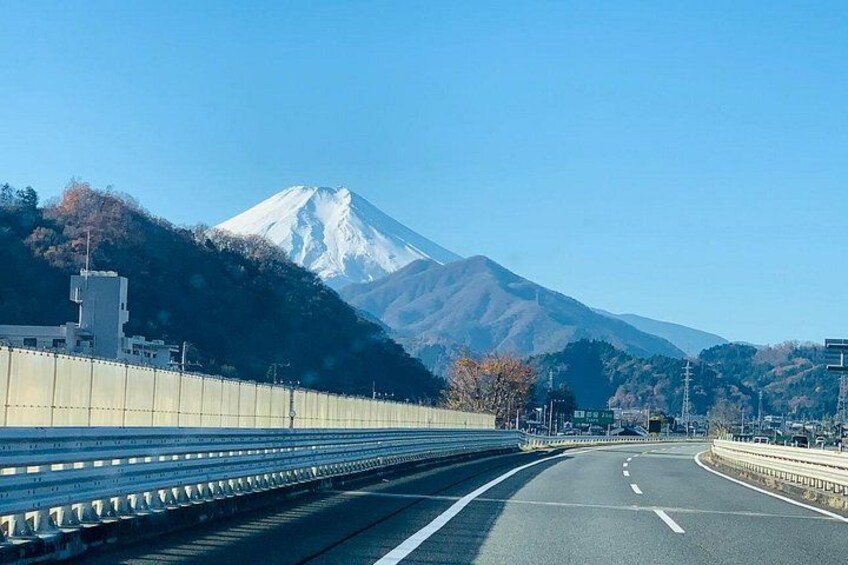 A highway with a mountain in the background. 2