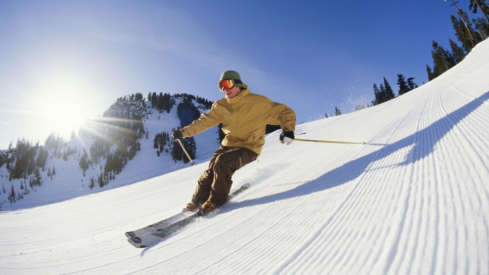 Man skiing down a slope in Park City