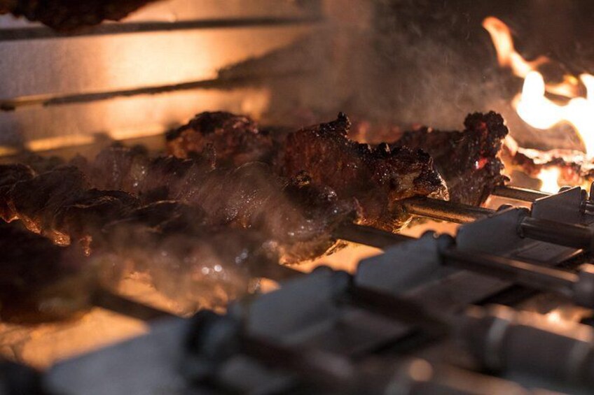 Meat grilling over an open flame. 3