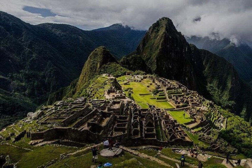 Machu Picchu, an ancient Incan city with terraced fields and stone structures, surrounded by mountains. 2