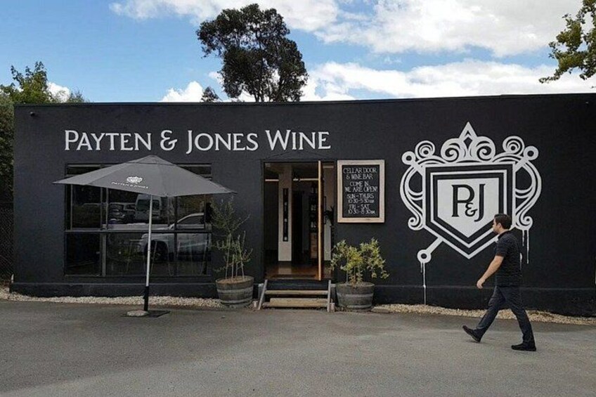 A building with the sign 'PAYTEN & JONES WINE' and a logo. 2