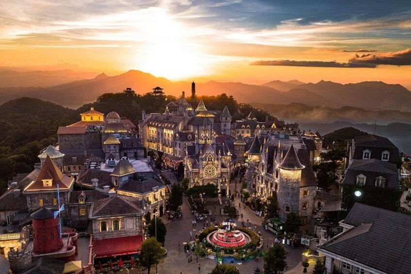 A historic castle complex with multiple towers and a central courtyard. 2
