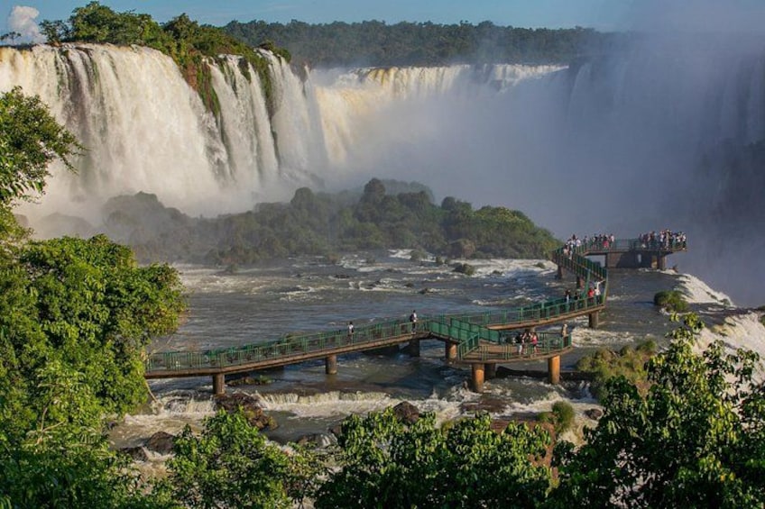 A large waterfall with a viewing platform and a bridge. 5
