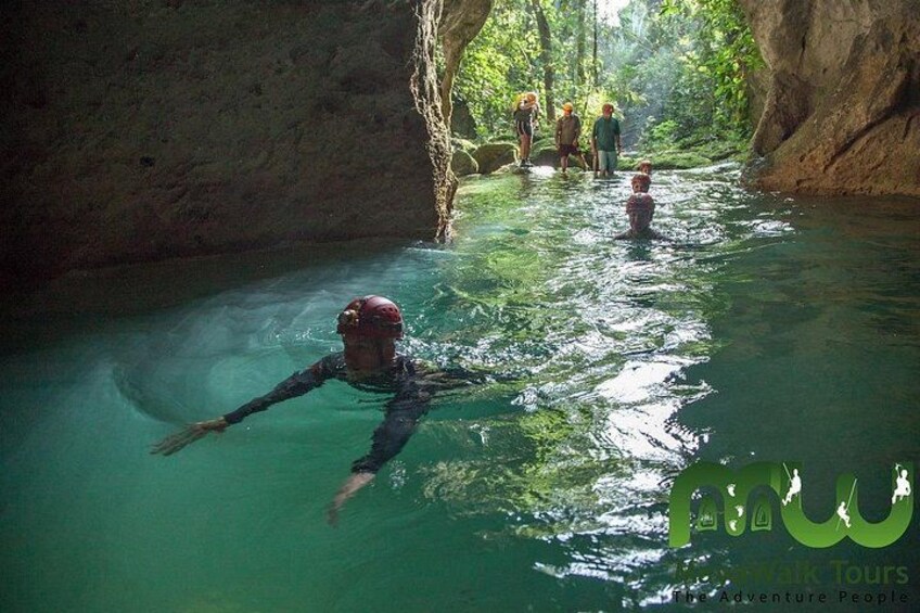Swimming into the entrance of the ATM Cave 5