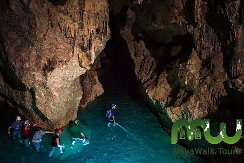 wading through the waters of the ATM cave 1
