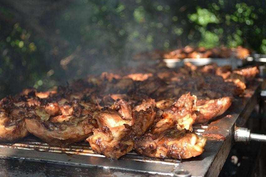 Grilled meat on a barbecue grill outdoors. 3