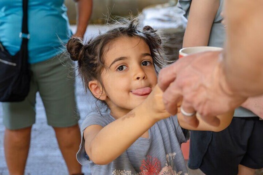 A child reaching out to an adult's hand. 5