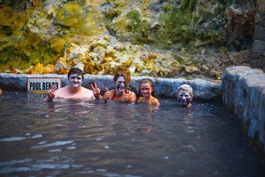 A natural hot spring with a sign reading 'POOL BENCH'. 5