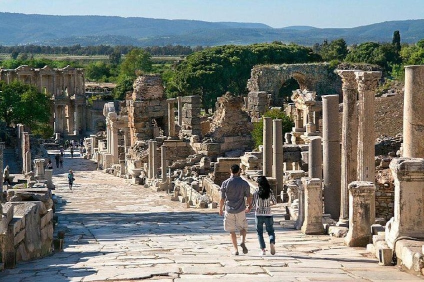 Ancient ruins with columns and stone pathways. 4