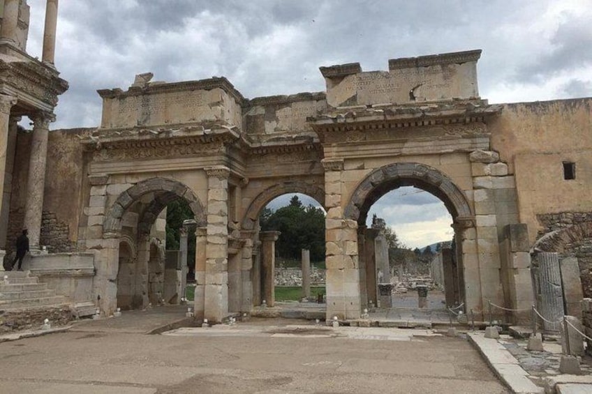 Ancient ruins with large stone arches and columns. 3