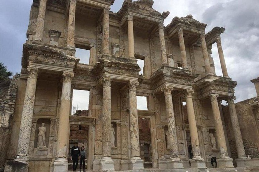 Ancient ruins with columns and statues. 2