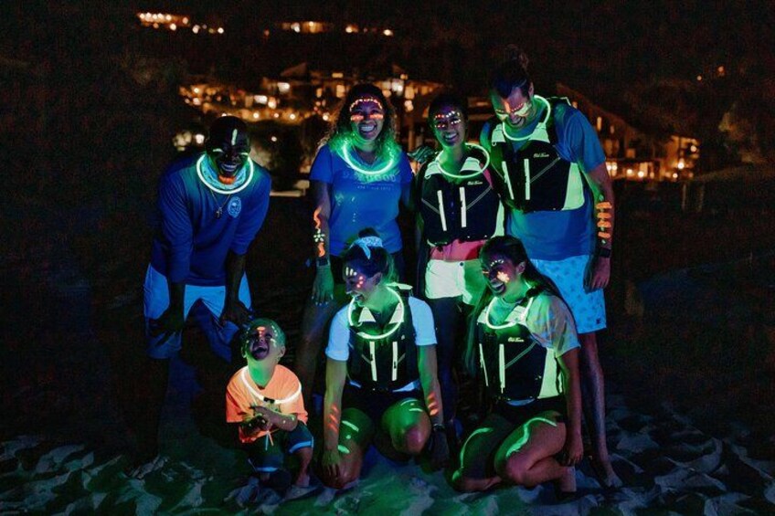 A group of people wearing glow-in-the-dark vests. 2