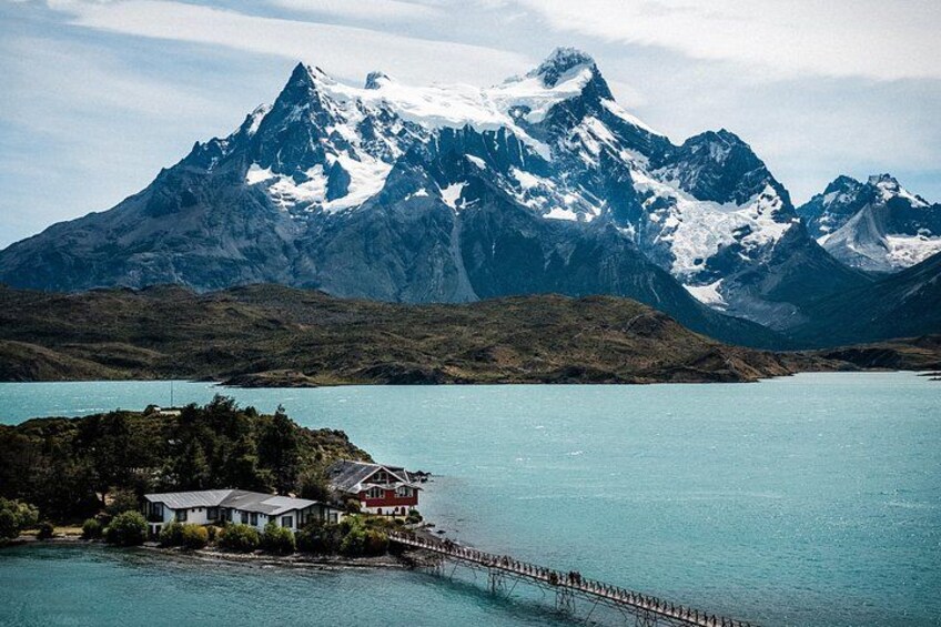 Lookout offers a panoramic vista across turquoise lustrous Lake Pehoé with an island hotel in the foreground and magnificent, snow-covered Cerro Paine Grande and Torres Del Paine as the backdrop. 2