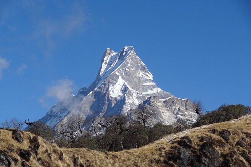 A snow-capped mountain with a clear sky. 4